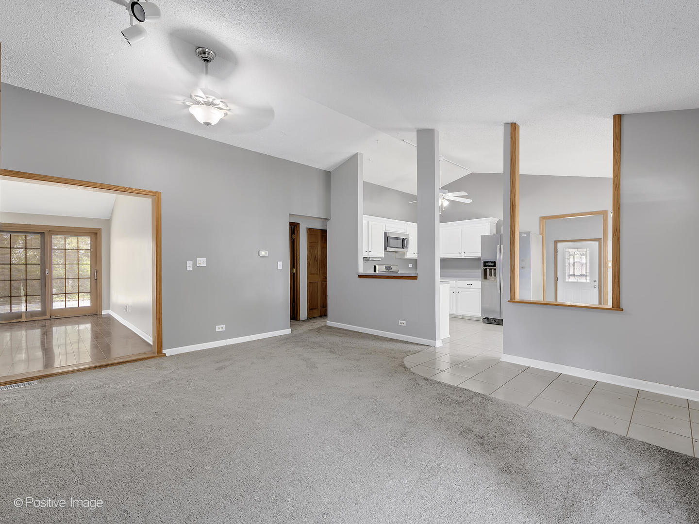 1985 Navarone Drive Naperville, IL 60565 - Photo 4 of 24 an empty room with windows and entrance to other room