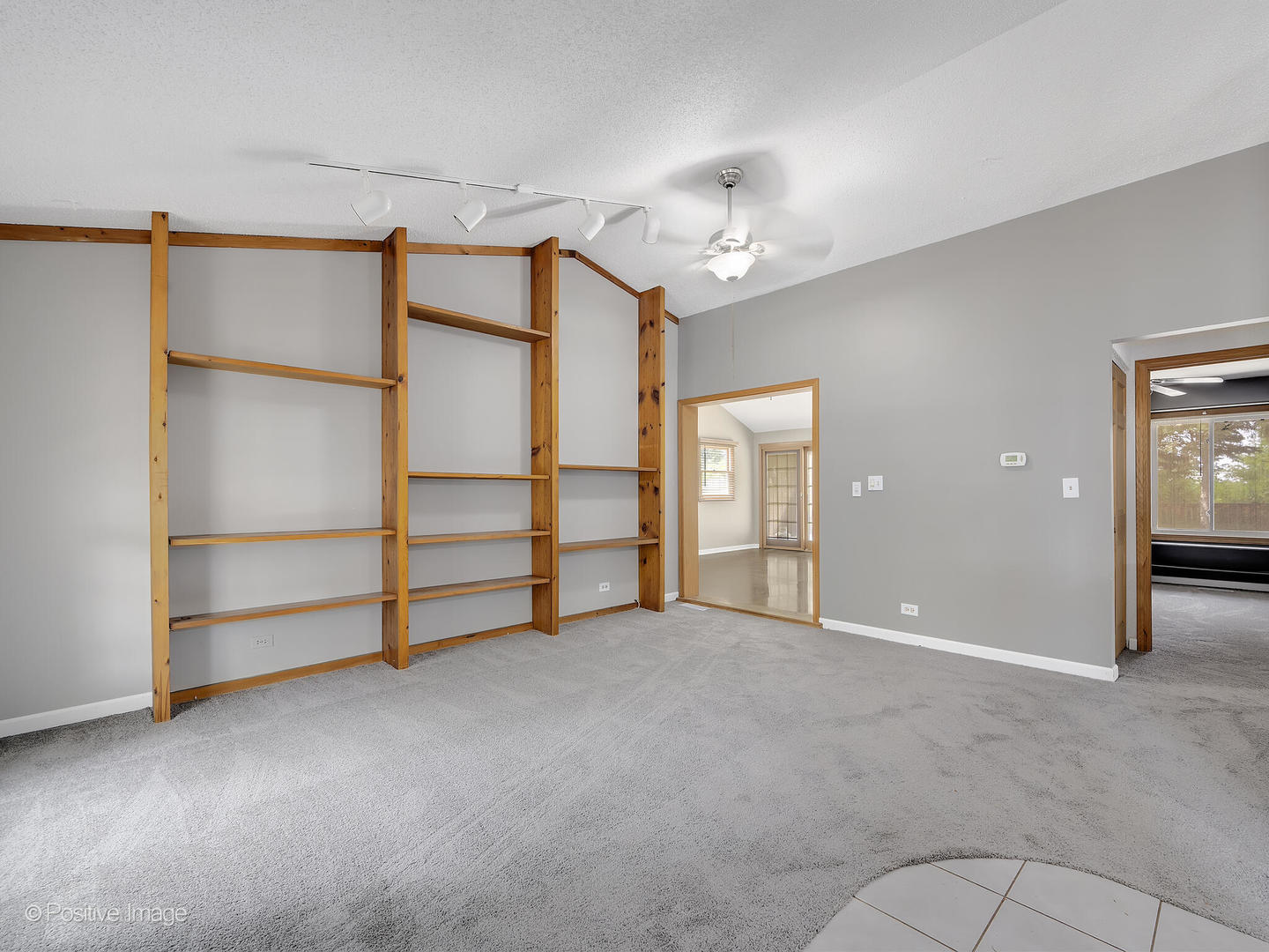 1985 Navarone Drive Naperville, IL 60565 - Photo 5 of 24 an empty room with a ceiling fan