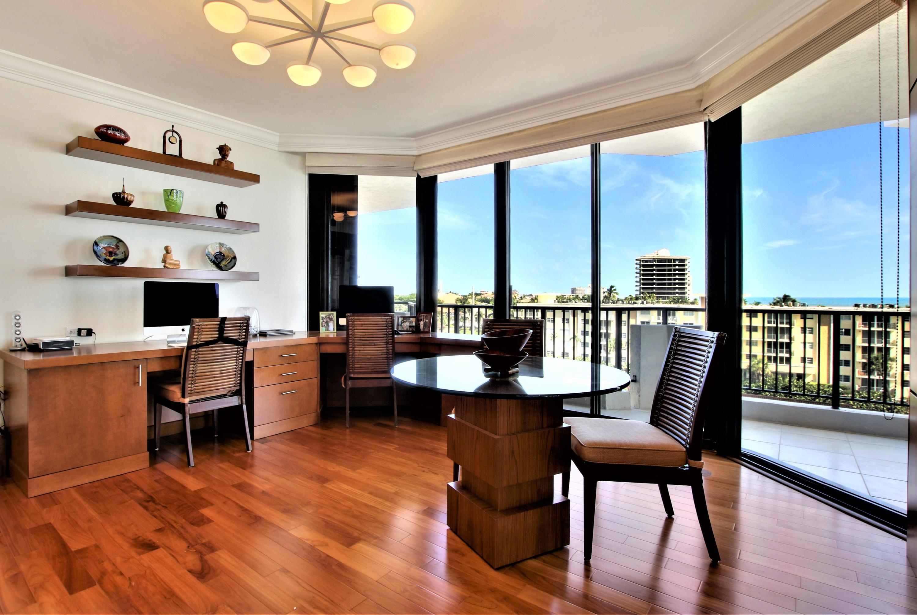 570 Ocean Drive, Unit 601 Juno Beach, FL 33408 - Photo 12 of 35 a dining room with furniture a large window and wooden floor