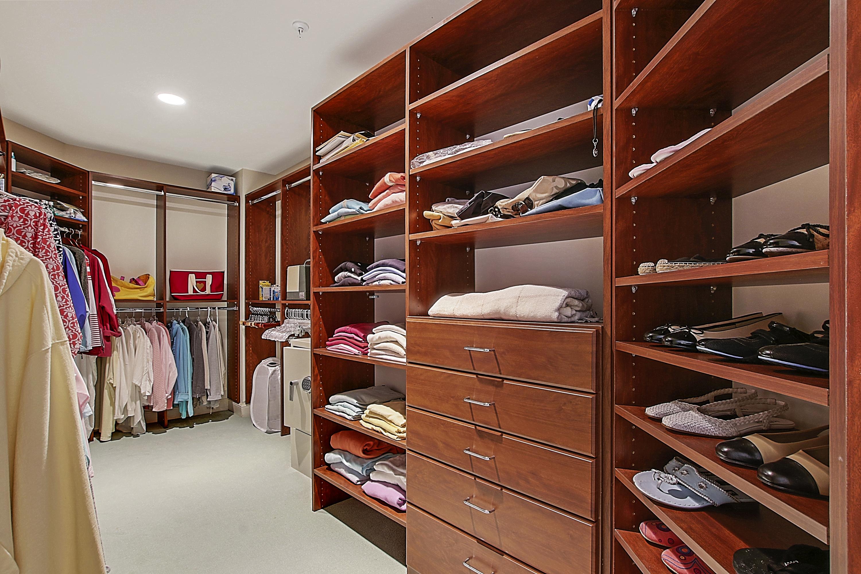 570 Ocean Drive, Unit 601 Juno Beach, FL 33408 - Photo 19 of 35 a view of walk in closet with clothes and shoes