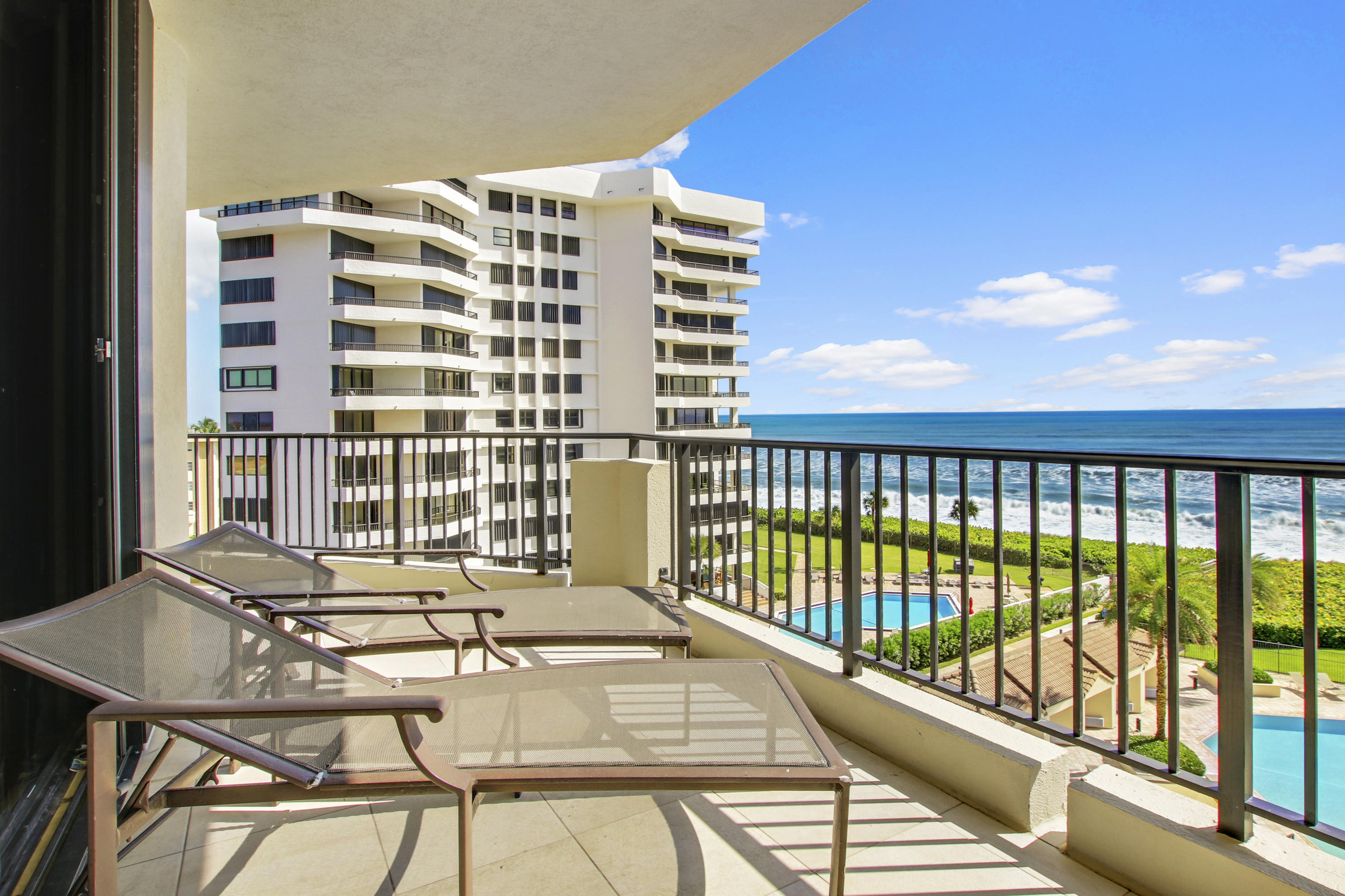 570 Ocean Drive, Unit 601 Juno Beach, FL 33408 - Photo 22 of 35 a balcony view with a large window and city view