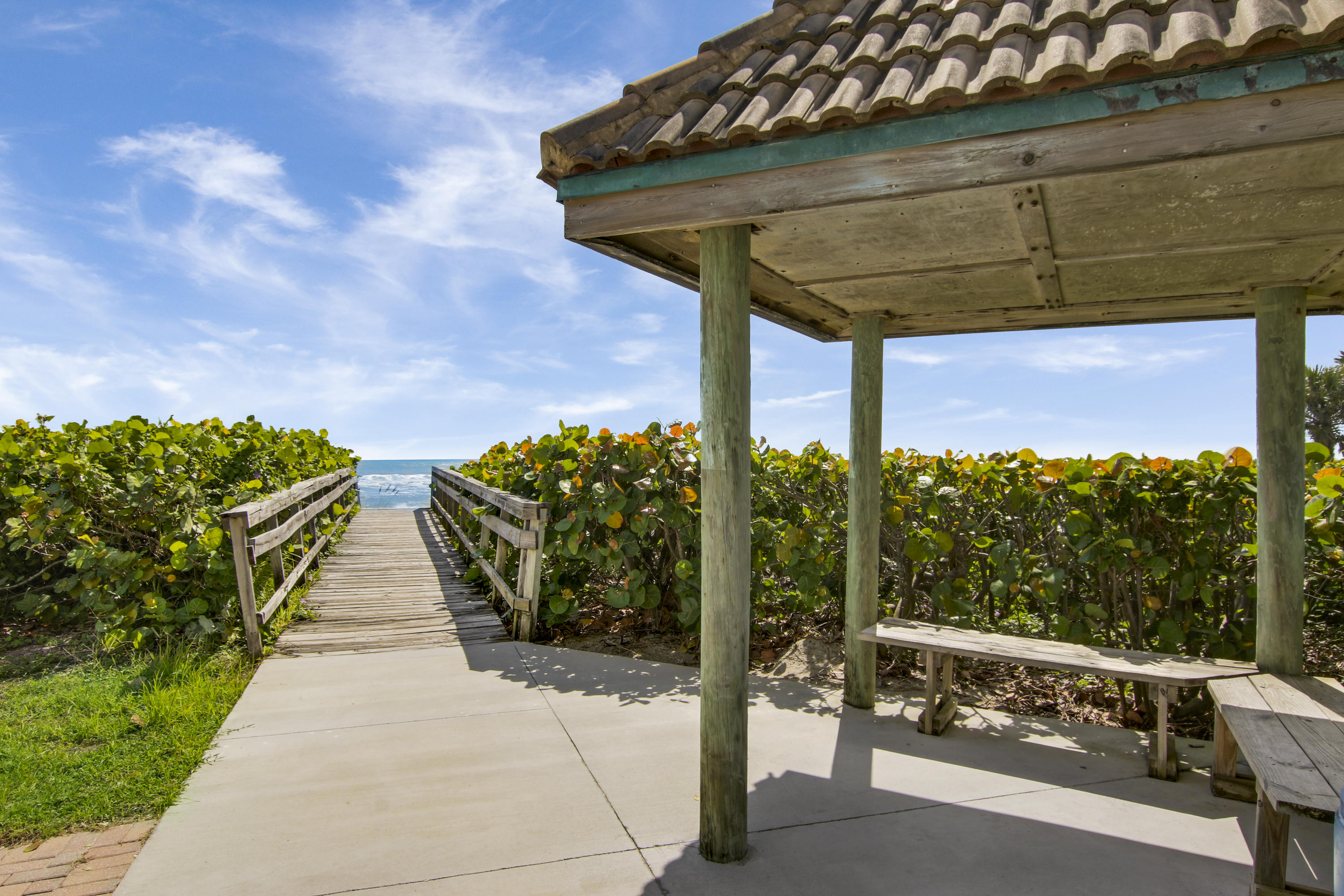 570 Ocean Drive, Unit 601 Juno Beach, FL 33408 - Photo 23 of 35 a view of a patio with table and chairs potted plants