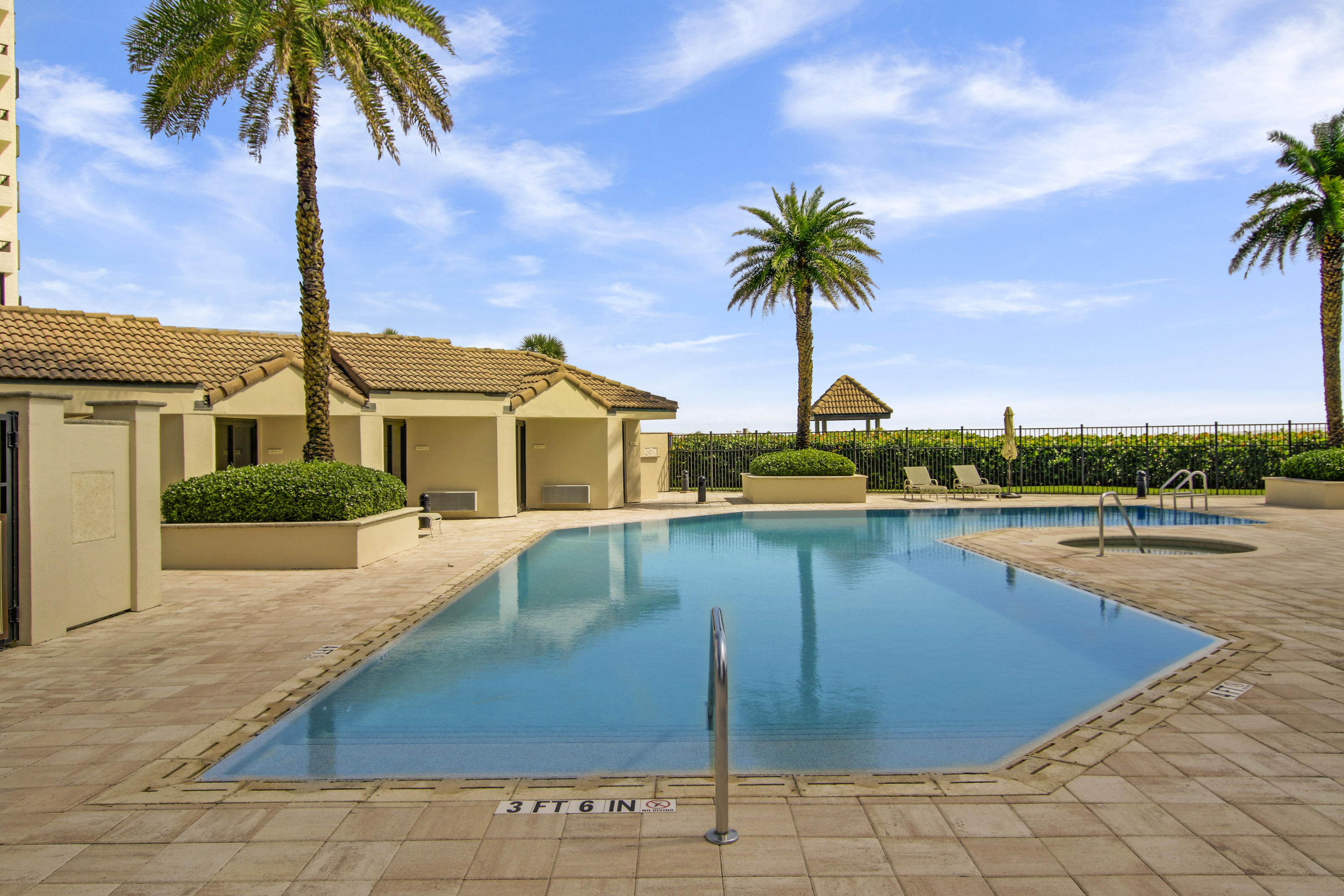 570 Ocean Drive, Unit 601 Juno Beach, FL 33408 - Photo 25 of 35 a front view of house with yard and swimming pool