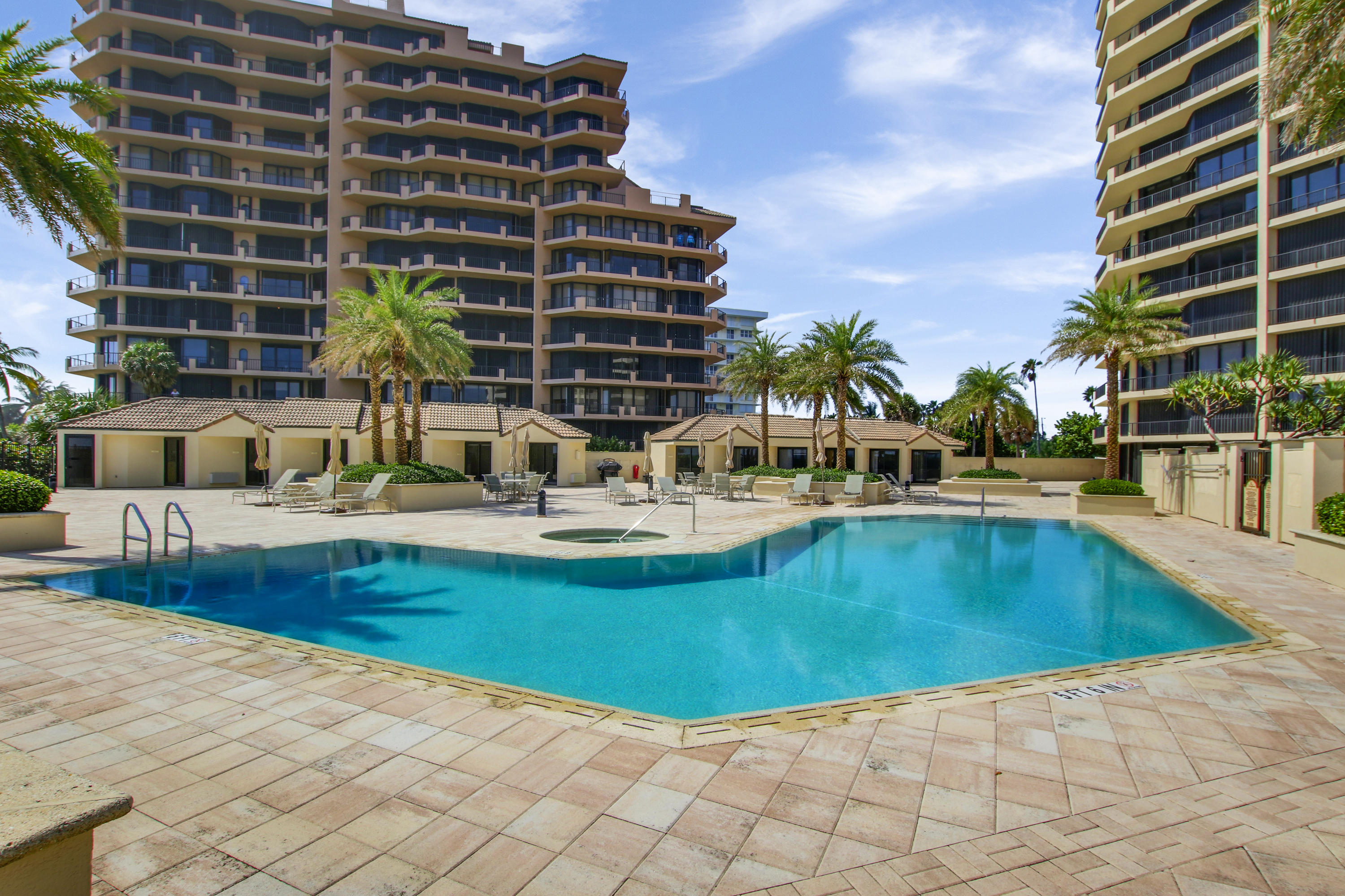 570 Ocean Drive, Unit 601 Juno Beach, FL 33408 - Photo 26 of 35 a swimming pool with outdoor seating