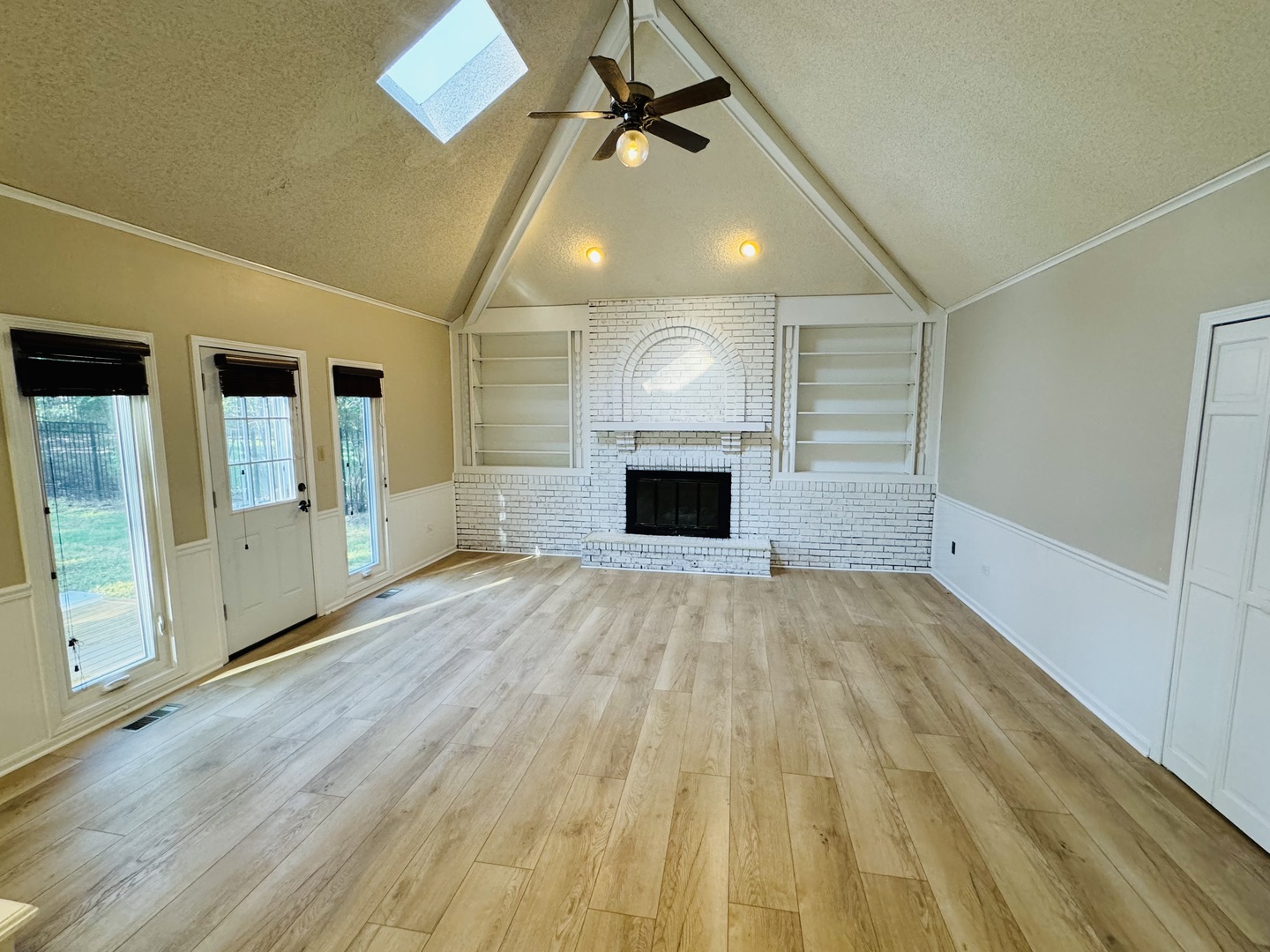 1398 East Gartner Road Naperville, IL 60540 - Photo 9 of 31 a view of empty room with wooden floor and fan