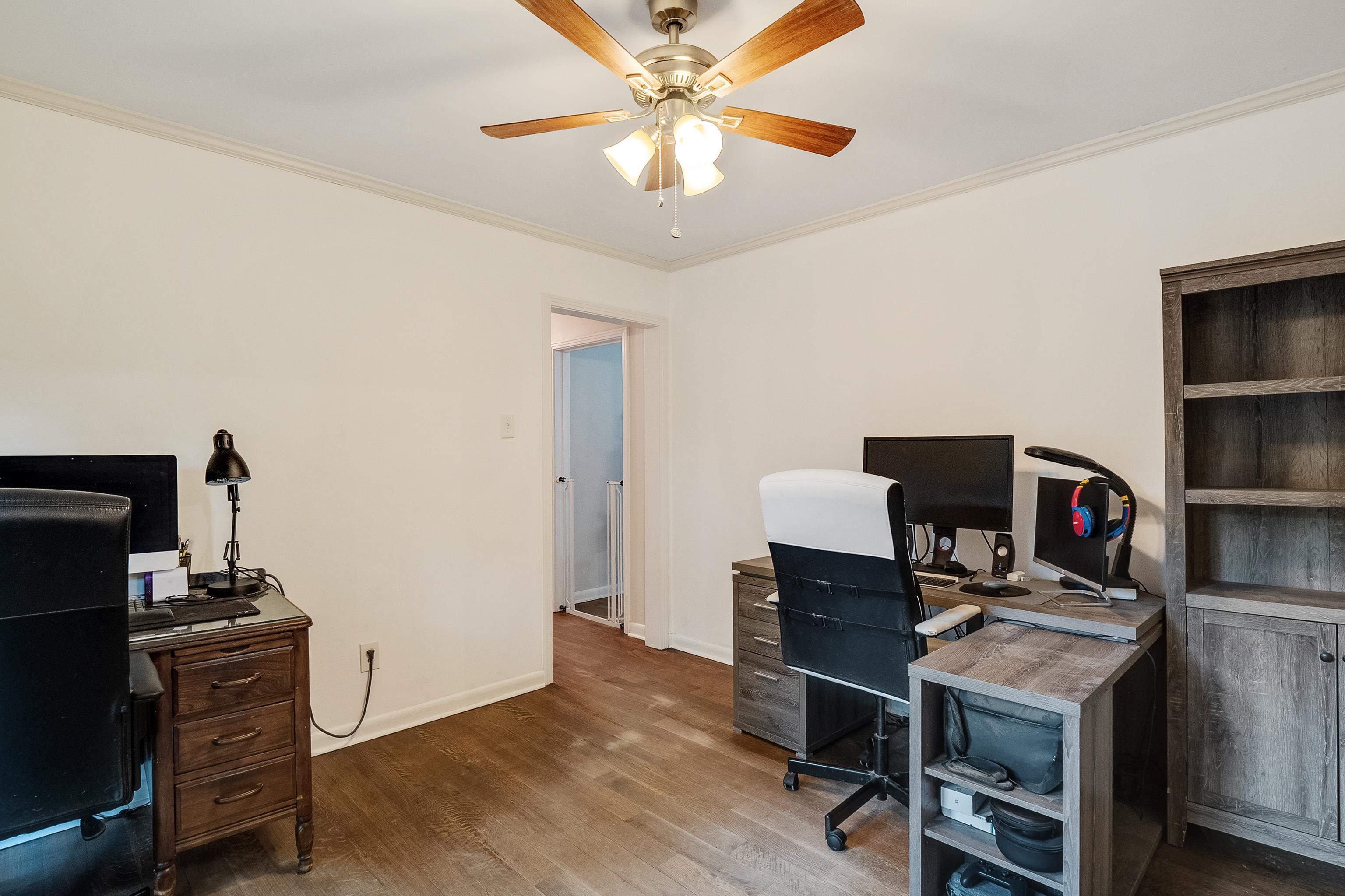 5069 Quince Road Memphis, TN 38117 - Photo 16 of 25 a workspace with furniture and wooden floor