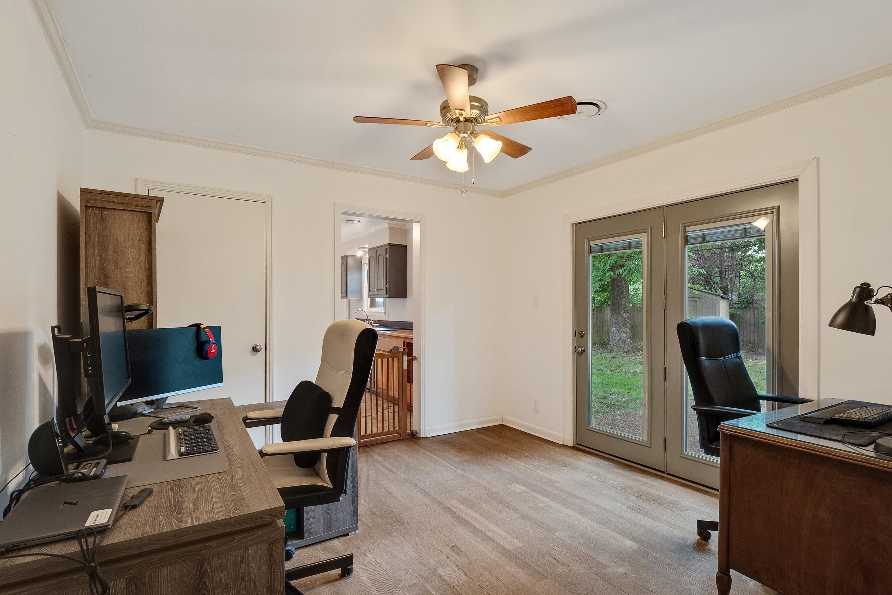 5069 Quince Road Memphis, TN 38117 - Photo 17 of 25 a view of a workspace with furniture and a window