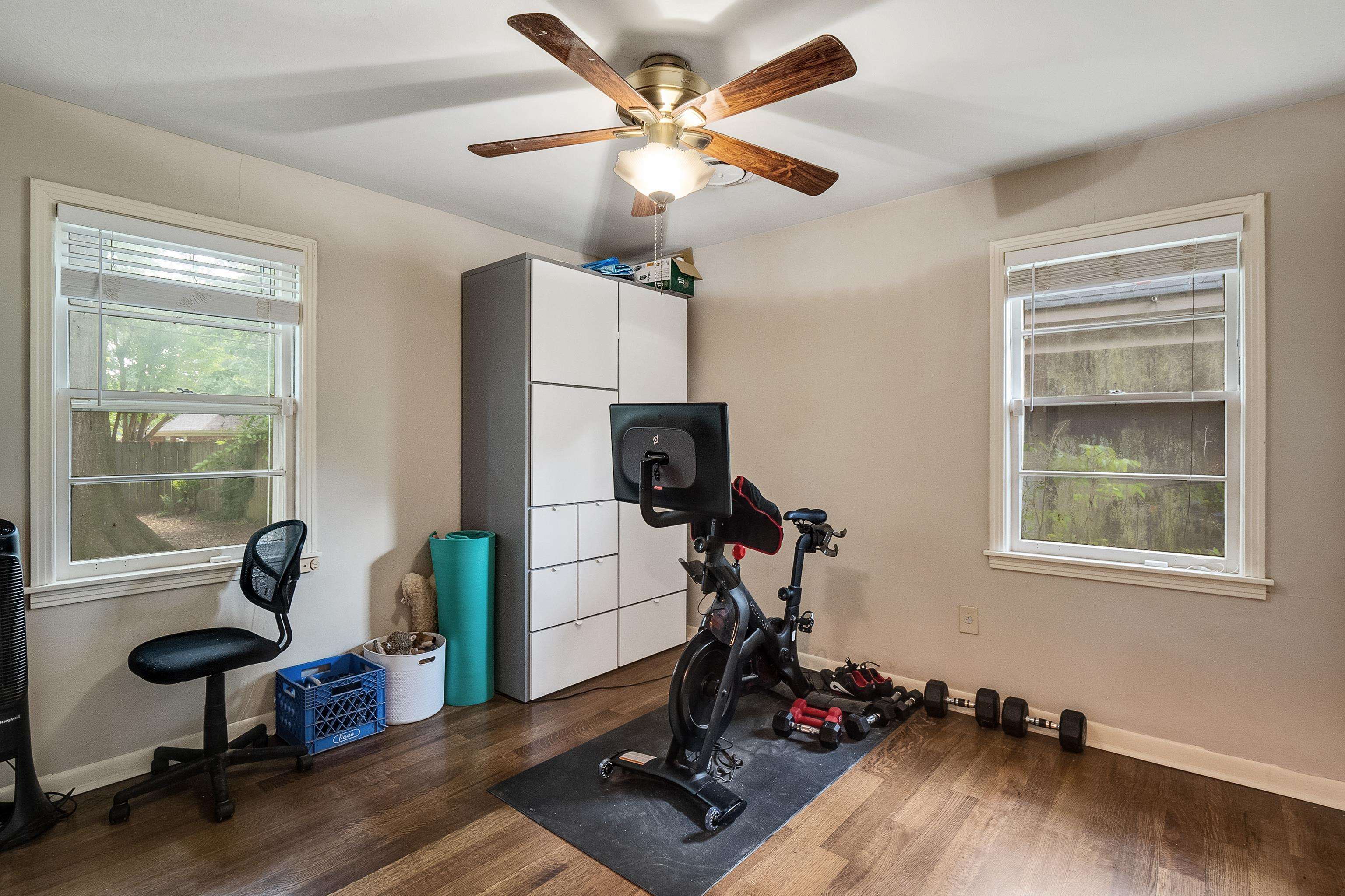 5069 Quince Road Memphis, TN 38117 - Photo 19 of 25 a view of a workspace with furniture and a window