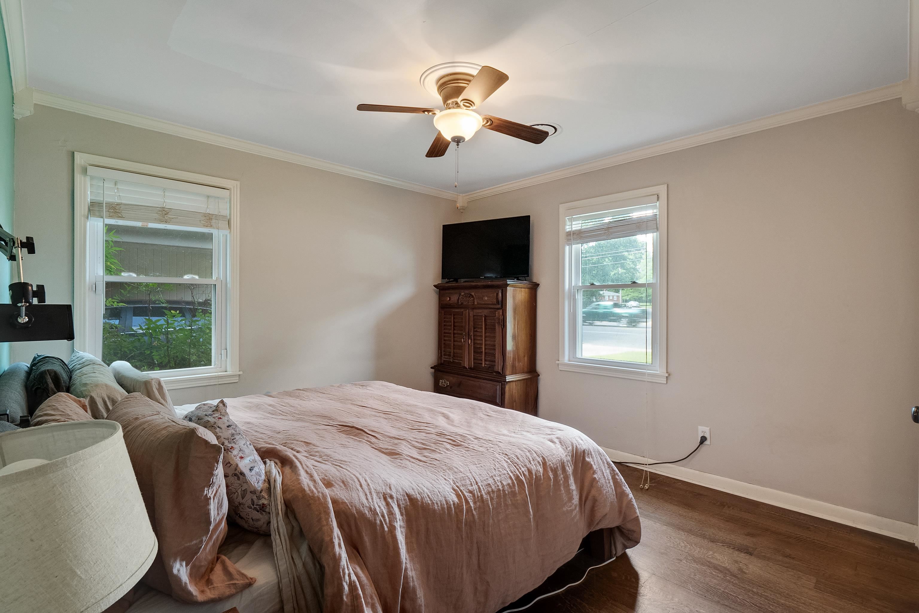 5069 Quince Road Memphis, TN 38117 - Photo 20 of 25 a bed sitting in a spacious bedroom next to a window