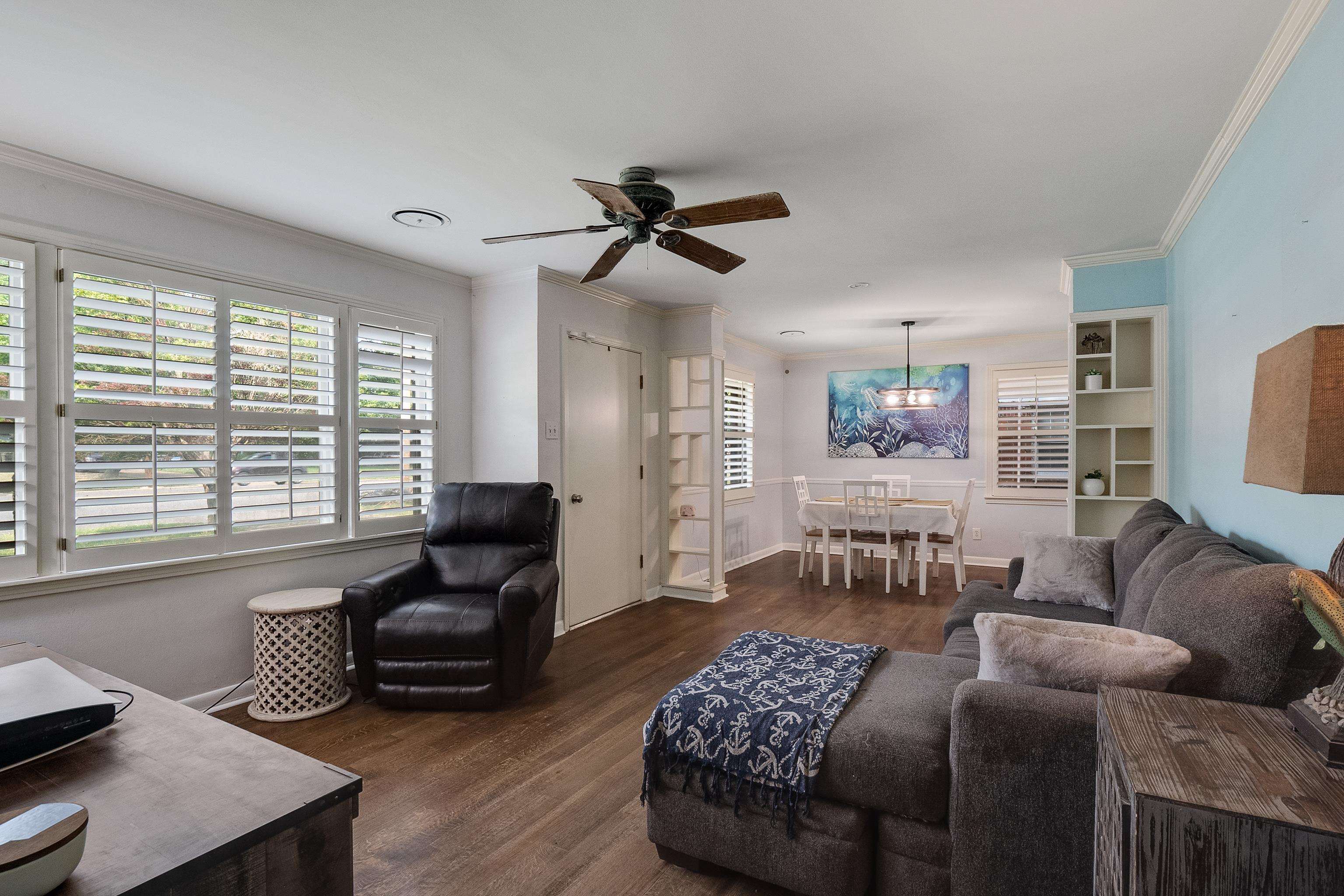 5069 Quince Road Memphis, TN 38117 - Photo 6 of 25 a living room with furniture ceiling fan and a window
