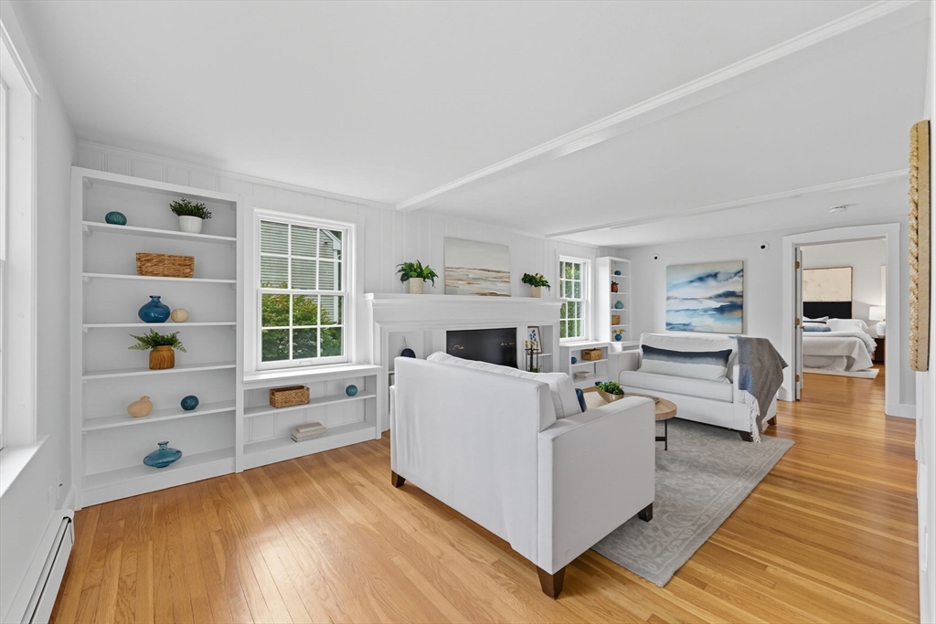22 Burlington Street Lexington, MA 02420 - Photo 14 of 32 a living room with furniture and a fireplace