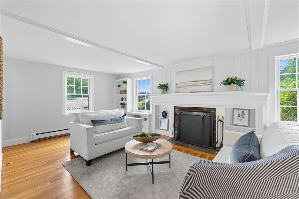 22 Burlington Street Lexington, MA 02420 - Photo 16 of 32 a living room with furniture and a fireplace