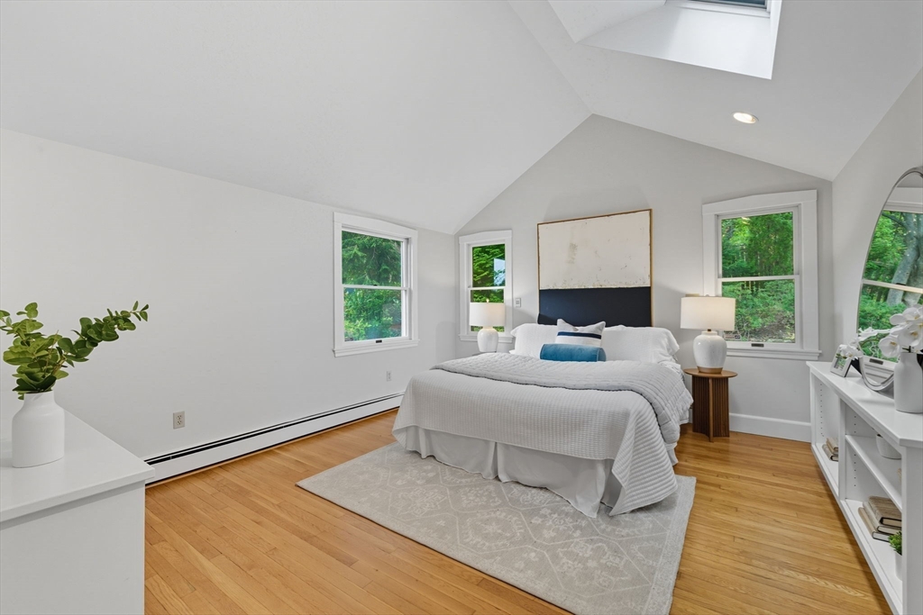 22 Burlington Street Lexington, MA 02420 - Photo 17 of 32 a bedroom with a large bed and a window