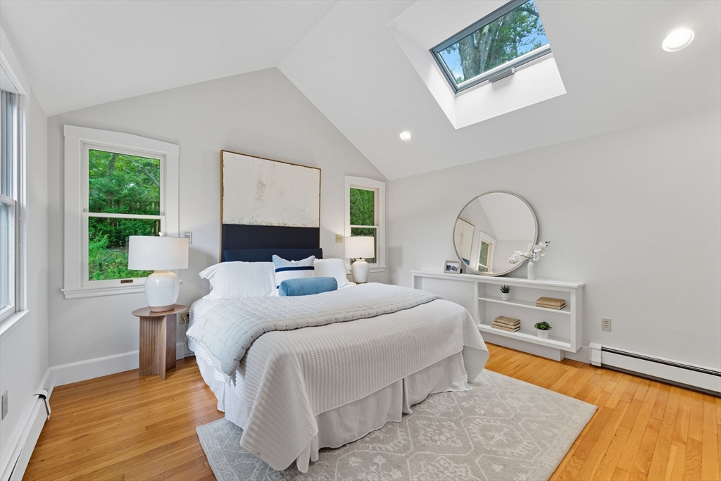 22 Burlington Street Lexington, MA 02420 - Photo 18 of 32 a bedroom with a bed and a dresser