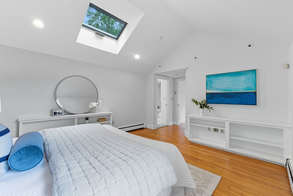 22 Burlington Street Lexington, MA 02420 - Photo 19 of 32 a bedroom with a bed and a flat screen tv