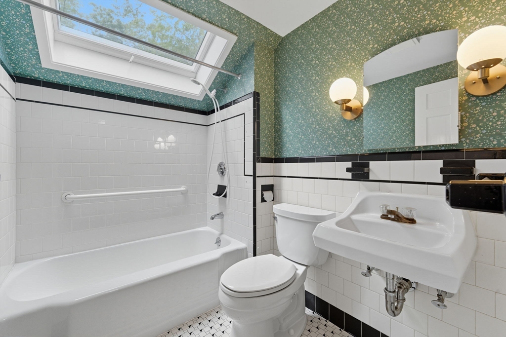 22 Burlington Street Lexington, MA 02420 - Photo 25 of 32 a bathroom with a sink a toilet and a mirror