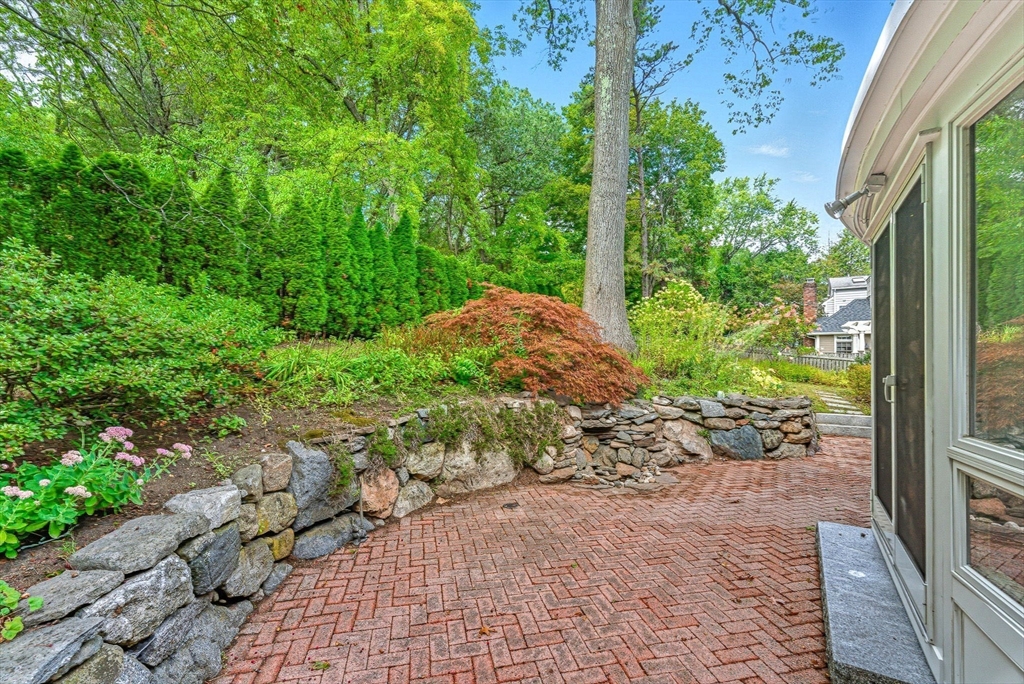 22 Burlington Street Lexington, MA 02420 - Photo 29 of 32 a view of a garden with plants and large trees