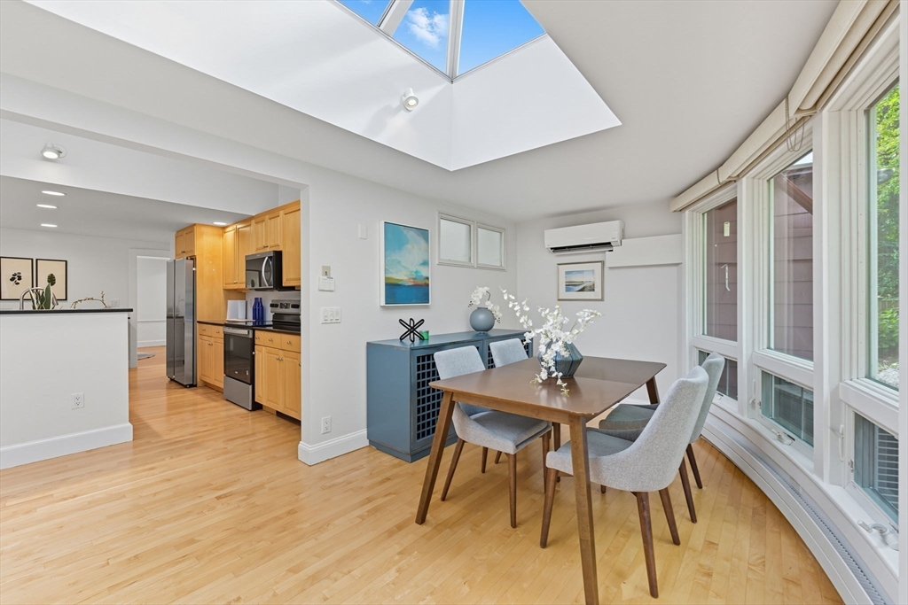 22 Burlington Street Lexington, MA 02420 - Photo 6 of 32 a view of a dining room with furniture and wooden floor