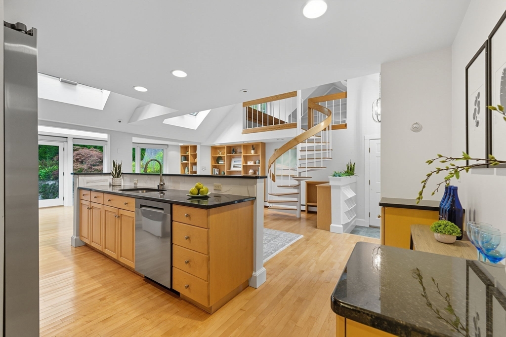 22 Burlington Street Lexington, MA 02420 - Photo 8 of 32 a kitchen with stainless steel appliances granite countertop a stove and a sink
