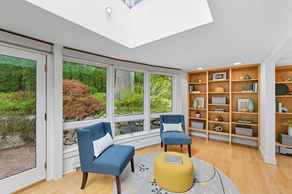 22 Burlington Street Lexington, MA 02420 - Photo 9 of 32 a living room with furniture and a floor to ceiling window