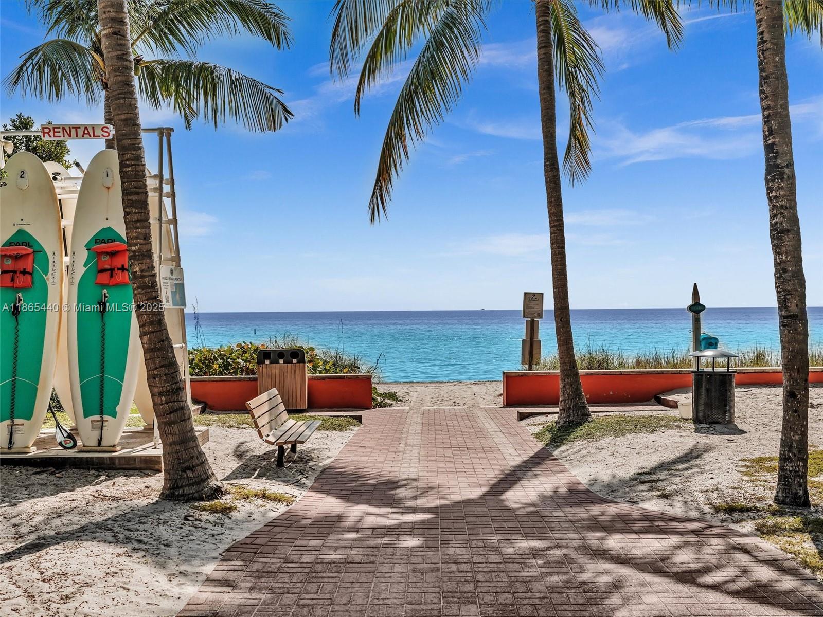 301 Sunrise Drive, Unit 1DW Key Biscayne, FL 33149 - Photo 24 of 40 swimming pool with outdoor seating