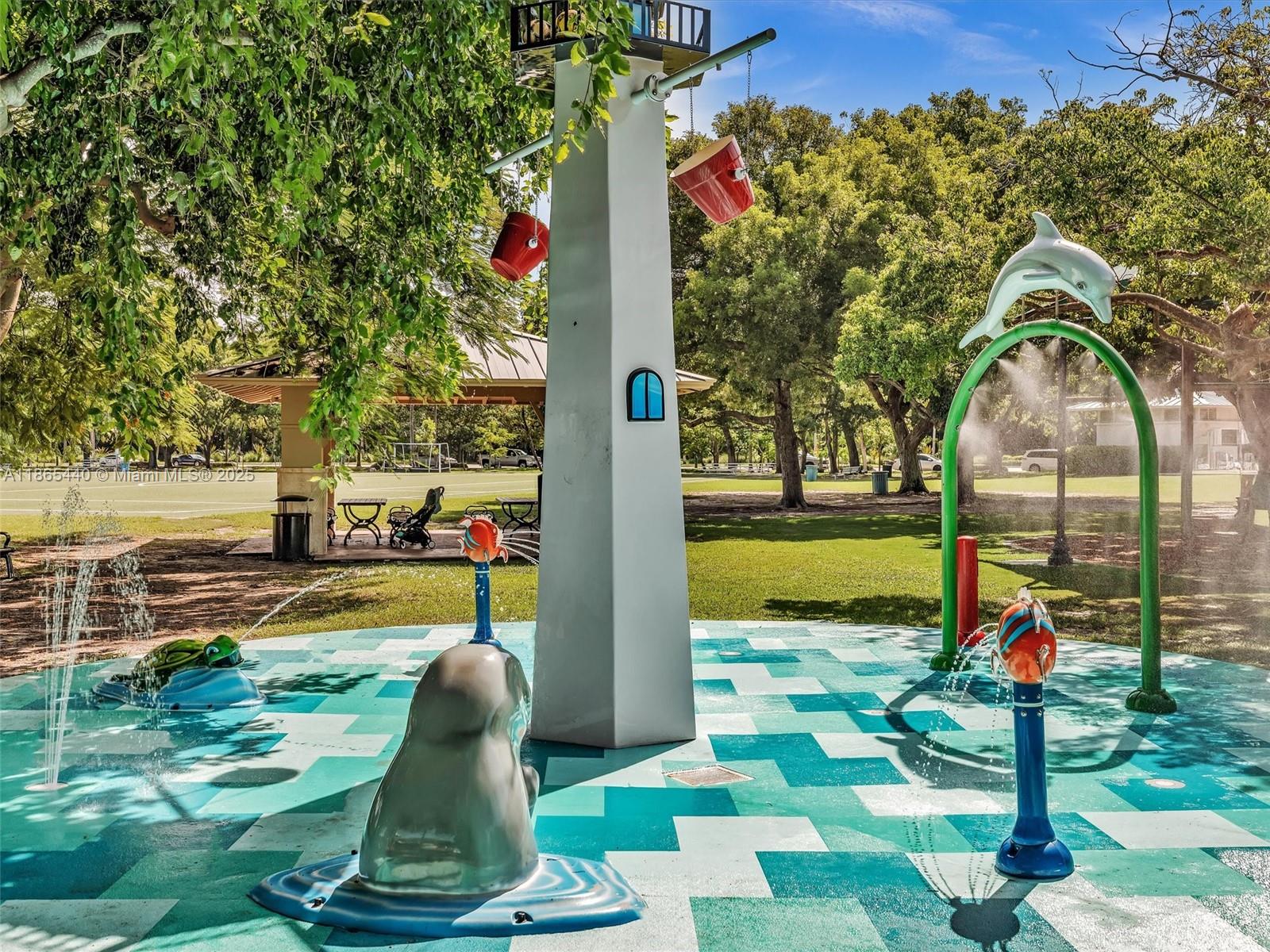 301 Sunrise Drive, Unit 1DW Key Biscayne, FL 33149 - Photo 29 of 40 a childrens park with lots of swings and slides