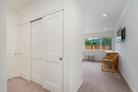a bathroom with a granite countertop toilet sink and mirror