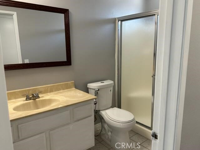 16115 3/4 Eucalyptus Avenue, Unit A Bellflower, CA 90706 - Photo 11 of 17 a bathroom with a toilet sink and mirror