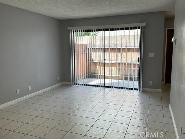 16115 3/4 Eucalyptus Avenue, Unit A Bellflower, CA 90706 - Photo 4 of 17 a view of an empty room and window