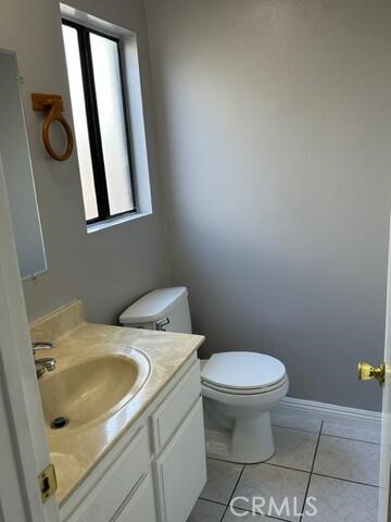 16115 3/4 Eucalyptus Avenue, Unit A Bellflower, CA 90706 - Photo 7 of 17 a bathroom with a sink toilet and mirror