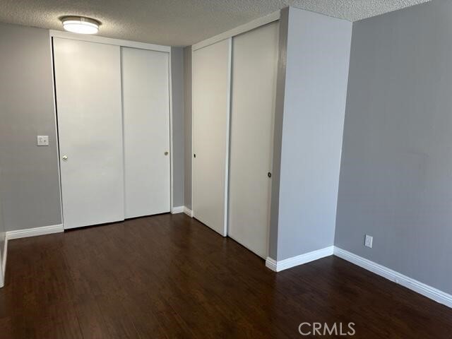 16115 3/4 Eucalyptus Avenue, Unit A Bellflower, CA 90706 - Photo 10 of 17 a view of an empty room with wooden floor