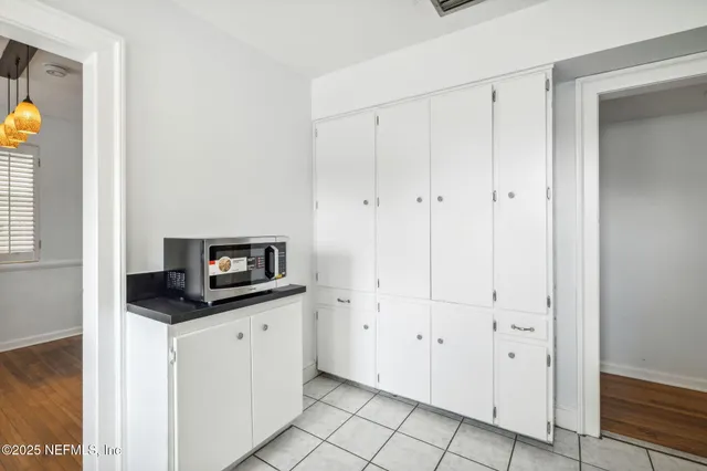 a kitchen with granite countertop a sink and a stove top oven