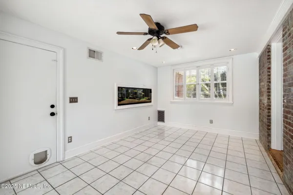 a view of an empty room with a window