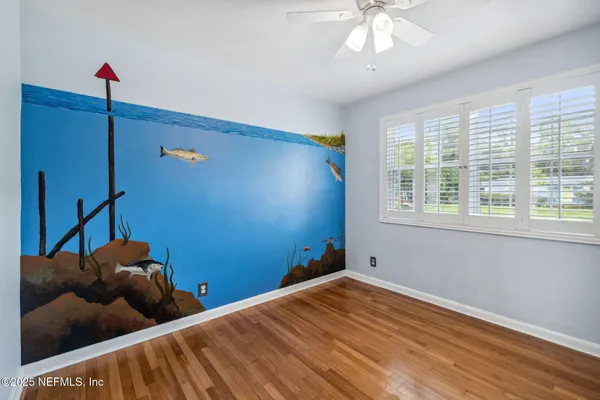 a view of a livingroom with wooden floor