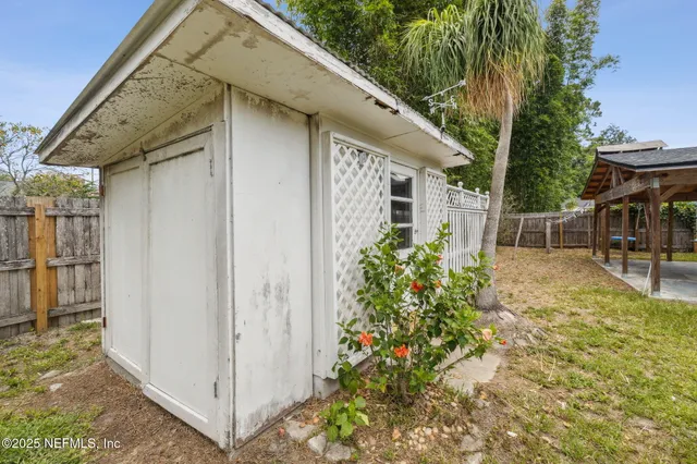 a view of a garage with wooden wall