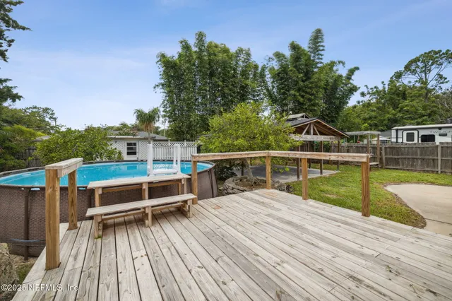 a view of a house with backyard porch and sitting area