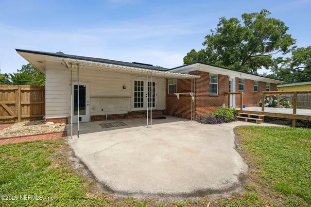 a view of a chair and table on the garden