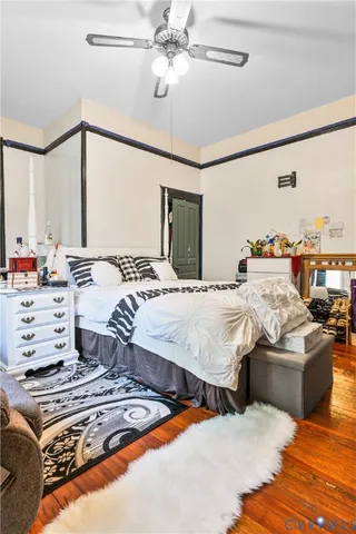 a bedroom with bed and window