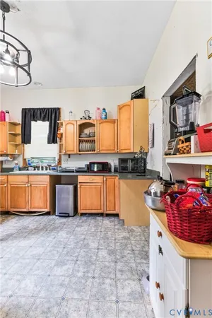 a kitchen with stainless steel appliances granite countertop a sink and cabinets