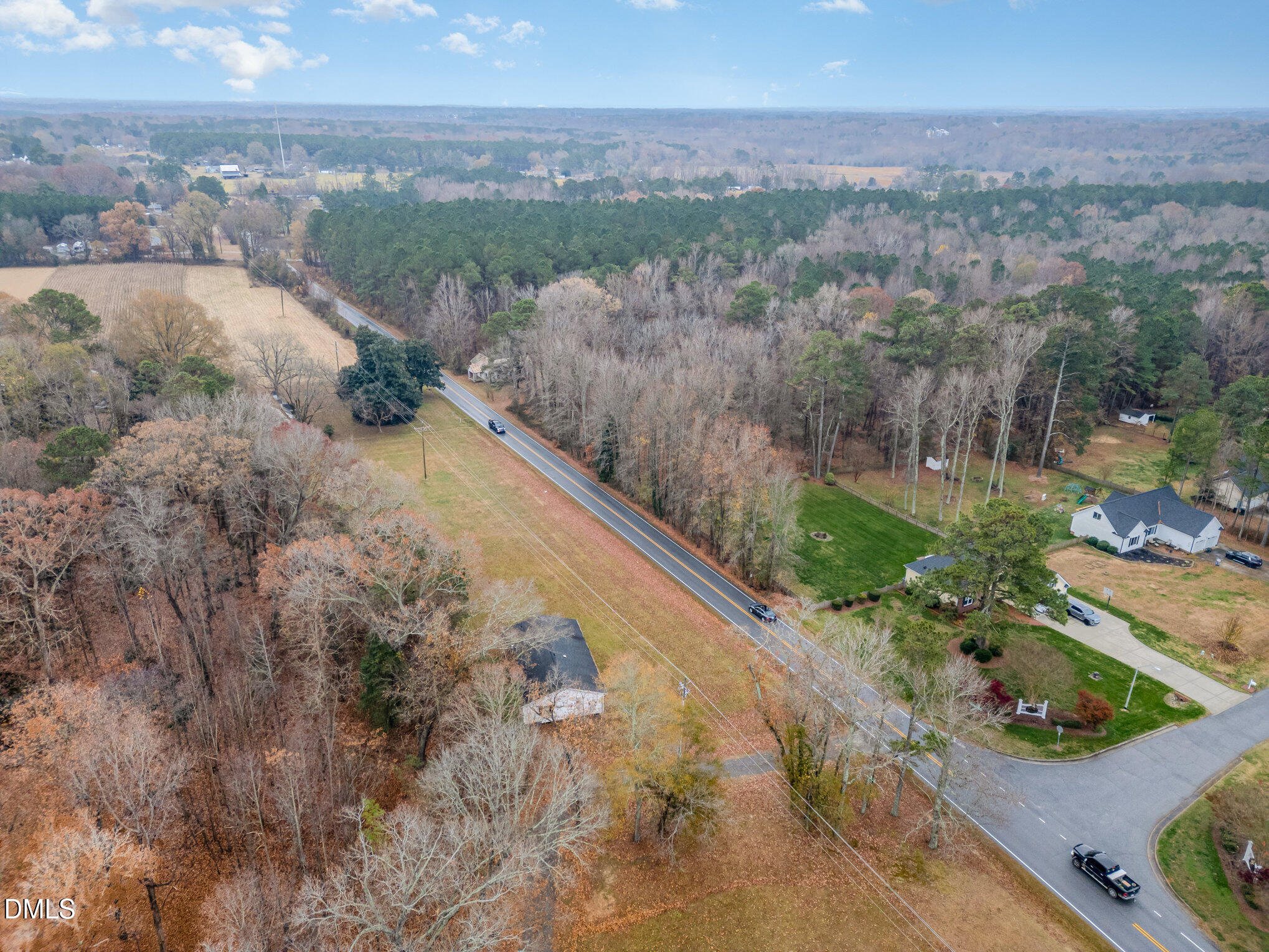 6801 Rock Service Station Road Raleigh, NC 27603 - Photo 24 of 36 a view of a yard with mountains