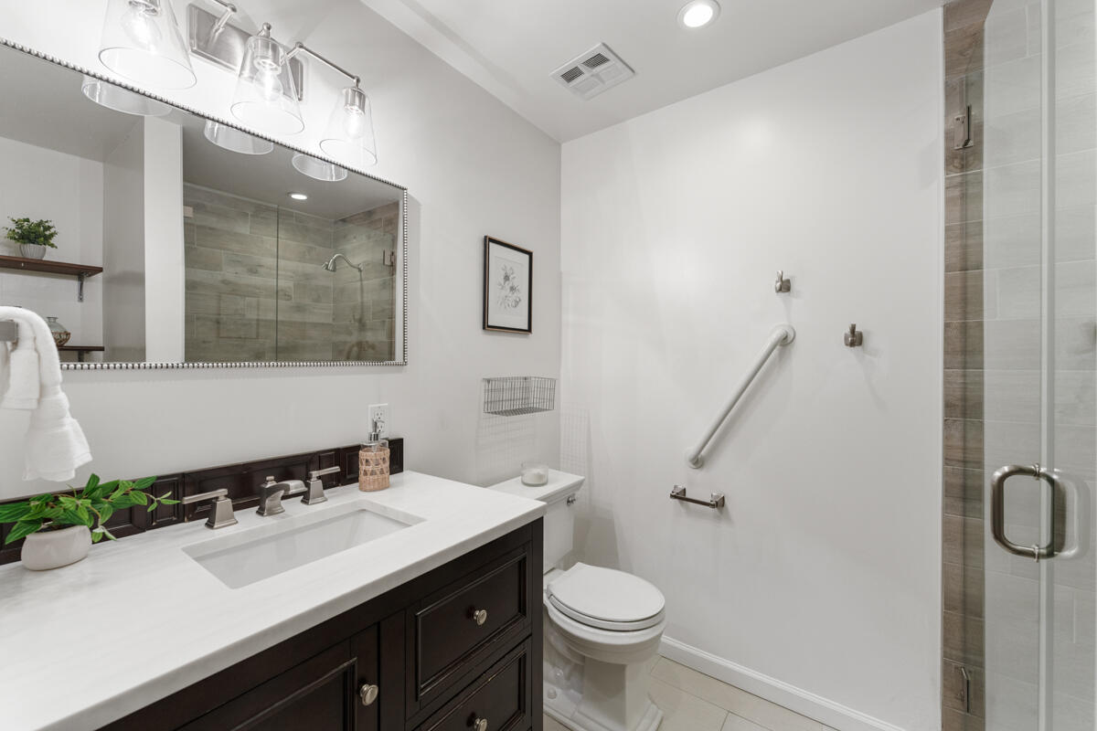 1436 Carnation Place Carpinteria, CA 93013 - Photo 15 of 32 a bathroom with a sink toilet and a mirror