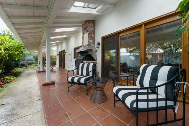 a view of a outdoor dining space with a table and chairs