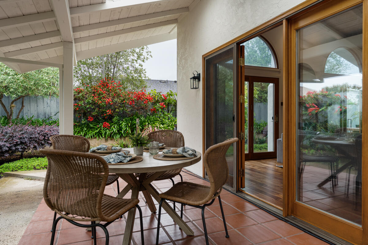 1436 Carnation Place Carpinteria, CA 93013 - Photo 22 of 32 a view of a outdoor dining space with a table and chairs