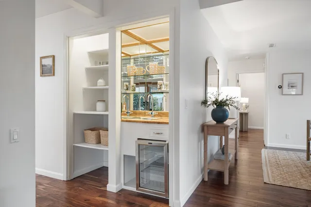 a bedroom with a bed and a lamp