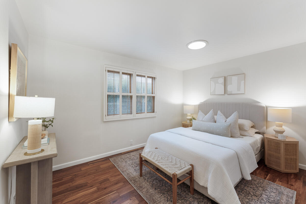 1436 Carnation Place Carpinteria, CA 93013 - Photo 10 of 32 a bedroom with a bed and a lamp