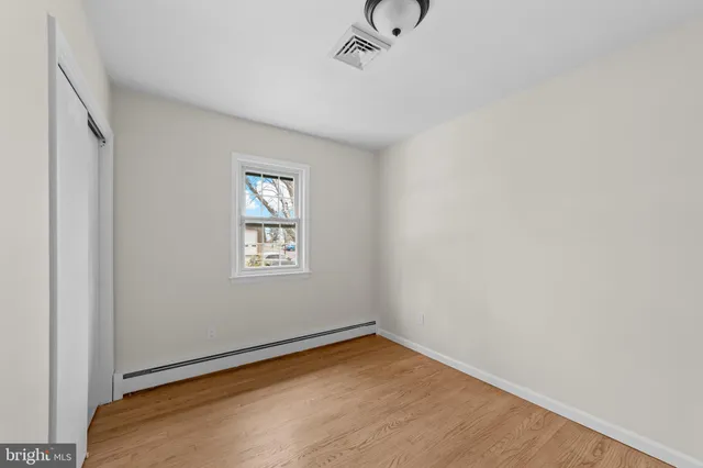 a view of empty room with windows