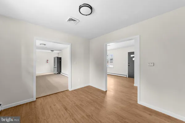 a view of a livingroom with wooden floor