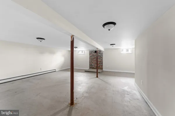 a view of an empty room with gym equipment