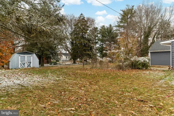 a view of a wooden door and lake view