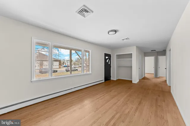a view of an empty room with a window